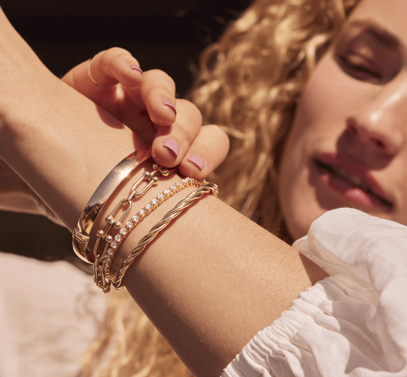 A woman adorned with her new beautiful Bracelets.