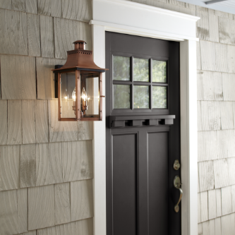 Copper lantern beside a door