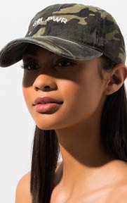 Grl Pwr Camo Hat balances edgy design and feminine influence with its distressed cap and stitched “GRL PWR” text graphic.