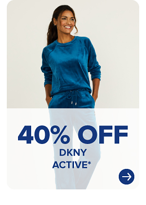 A woman in a blue activewear set. 40% off DKNY active.