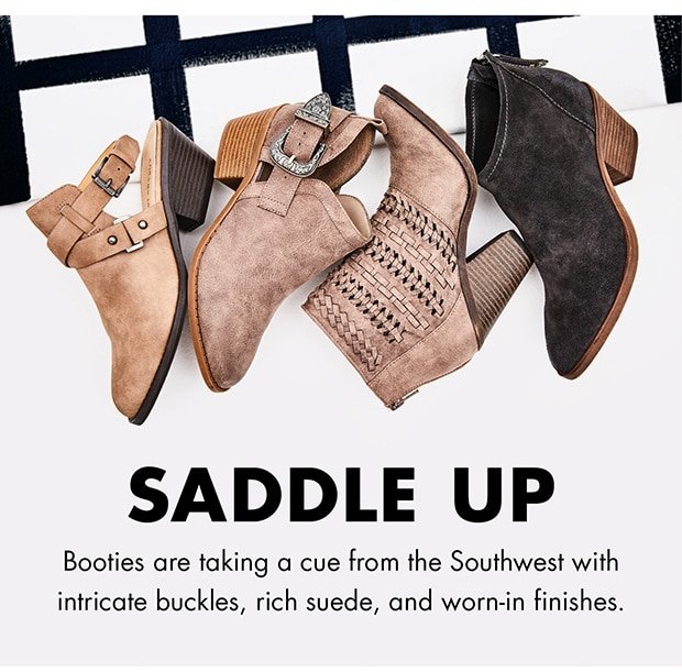 SADDLE UP Booties are taking a cue from the Southwest with intricate buckles, rich suede, and worn-in finishes.