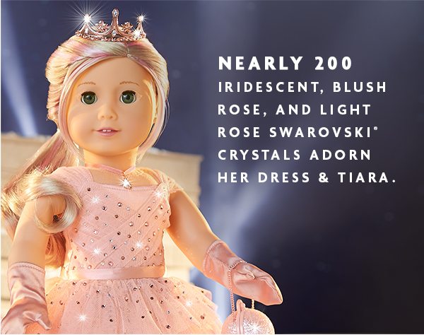 NEARLY 200 IRIDESCENT, BLUSH ROSE, AND LIGHT ROSE SWAROVSKI® CRYSTALS ADORN HER DRESS & TIARA