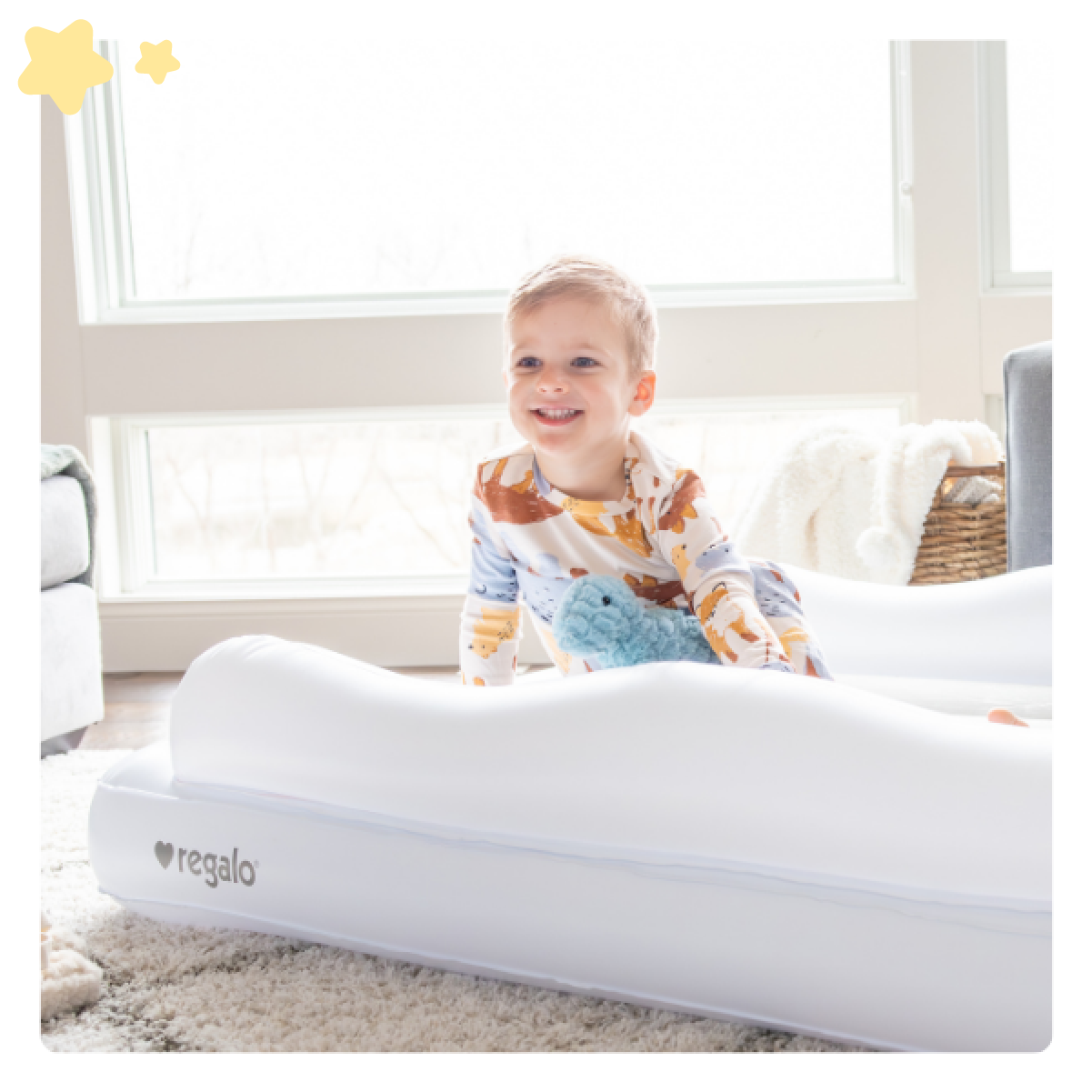 Toddler Sitting on Inflatable Toddler Bed