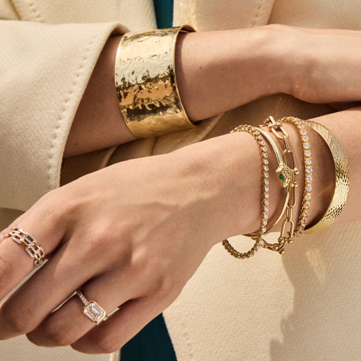 Woman adorning bracelets and rings