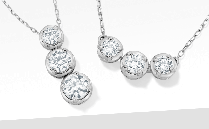 Two sets of diamonds pendants on silver chains