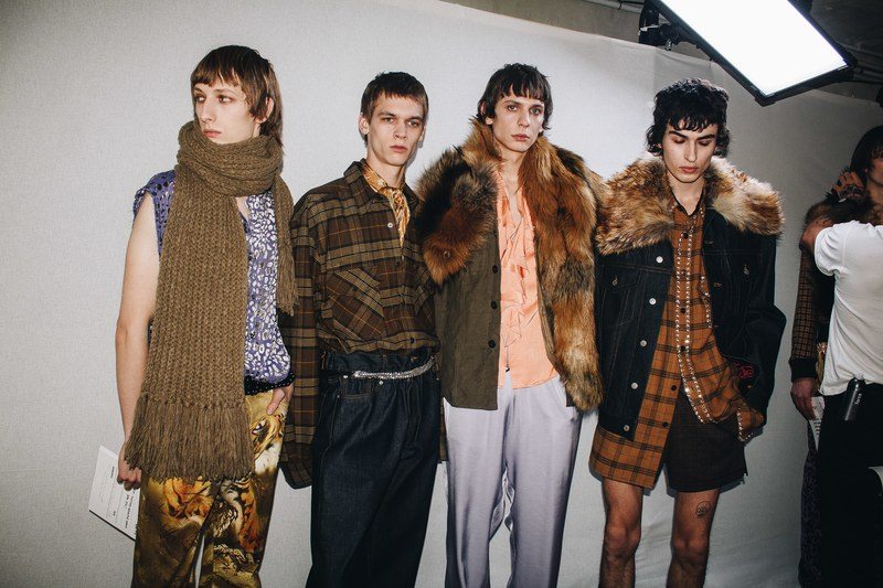 male models backstage wearing dries van noten 