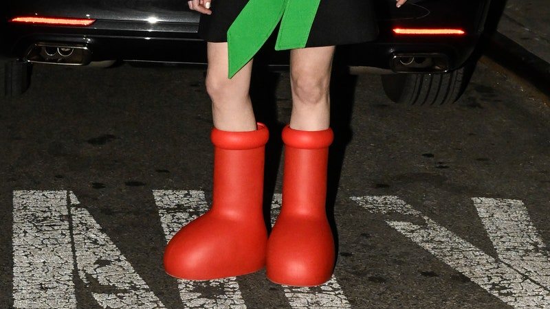 NEW YORK, NEW YORK - FEBRUARY 10: A guest is seen wearing a black and green jacket, white top, red beret and red boots outside the Collina Strada show during New York Fashion Week F/W 2023 on February 10, 2023 in New York City. (Photo by Daniel Zuchnik/Getty Images)