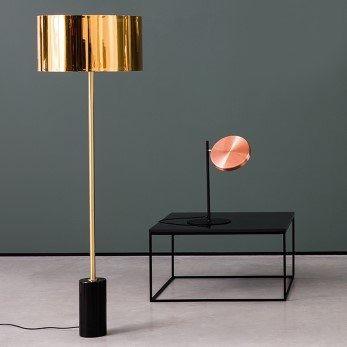 Gold floor lamp and black marble coffee table