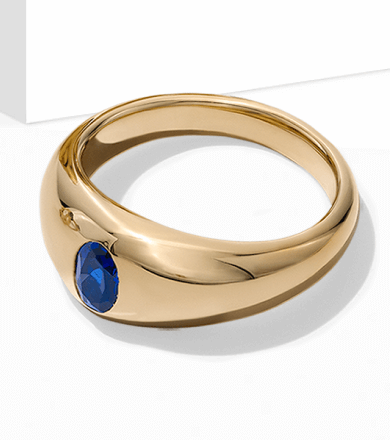 Image showcasing a beautiful Gold Ring, crowned with a sapphire.