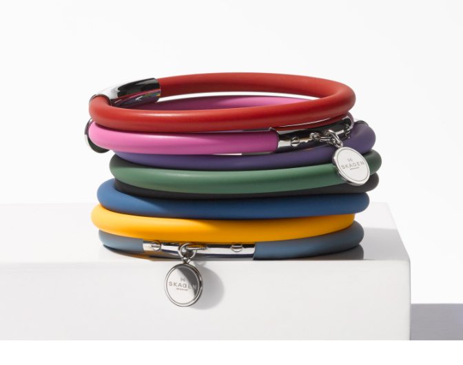A variety of colorful Blakely silicone and silver tone bracelets