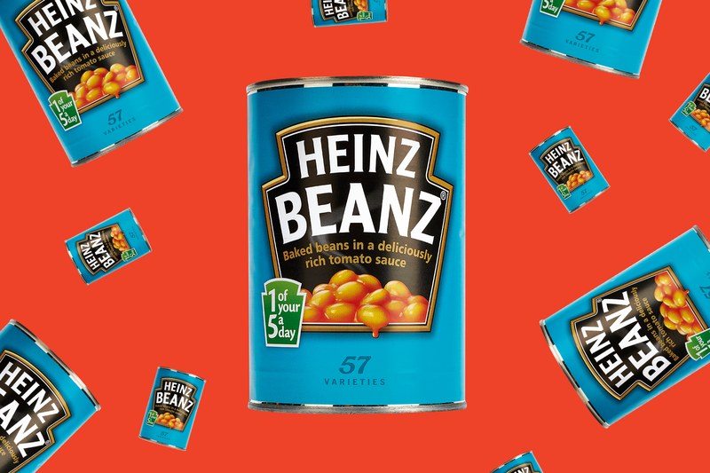 Many cans of Heinz Beans floating on an orange-red background