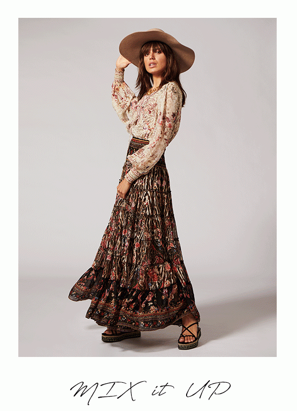 Model wearing CAMILLA cream leopard print blouse, with dark leopard print skirt.