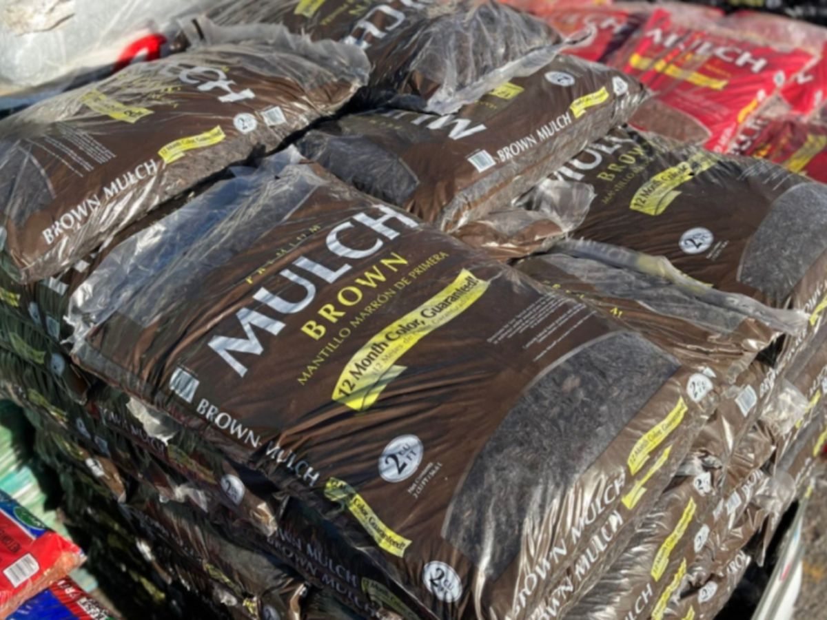 brown mulch bags stacked in pile at lowes