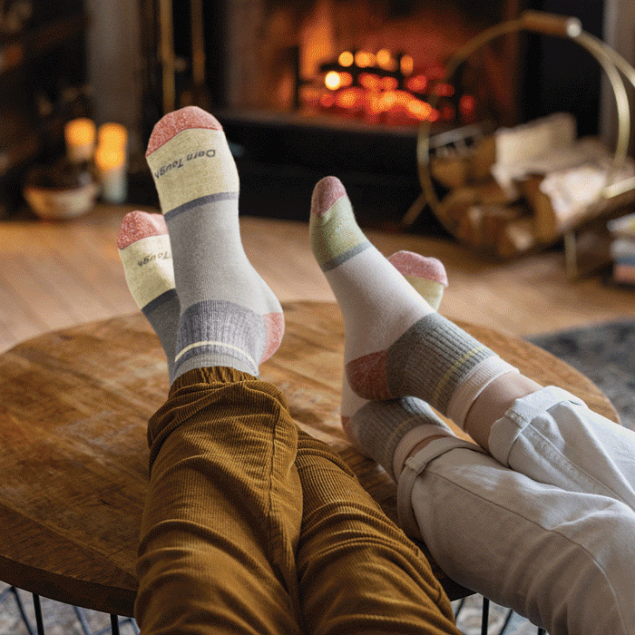 Shop Warm Socks - cozy feet in various locations, all wearing Darn Tough socks