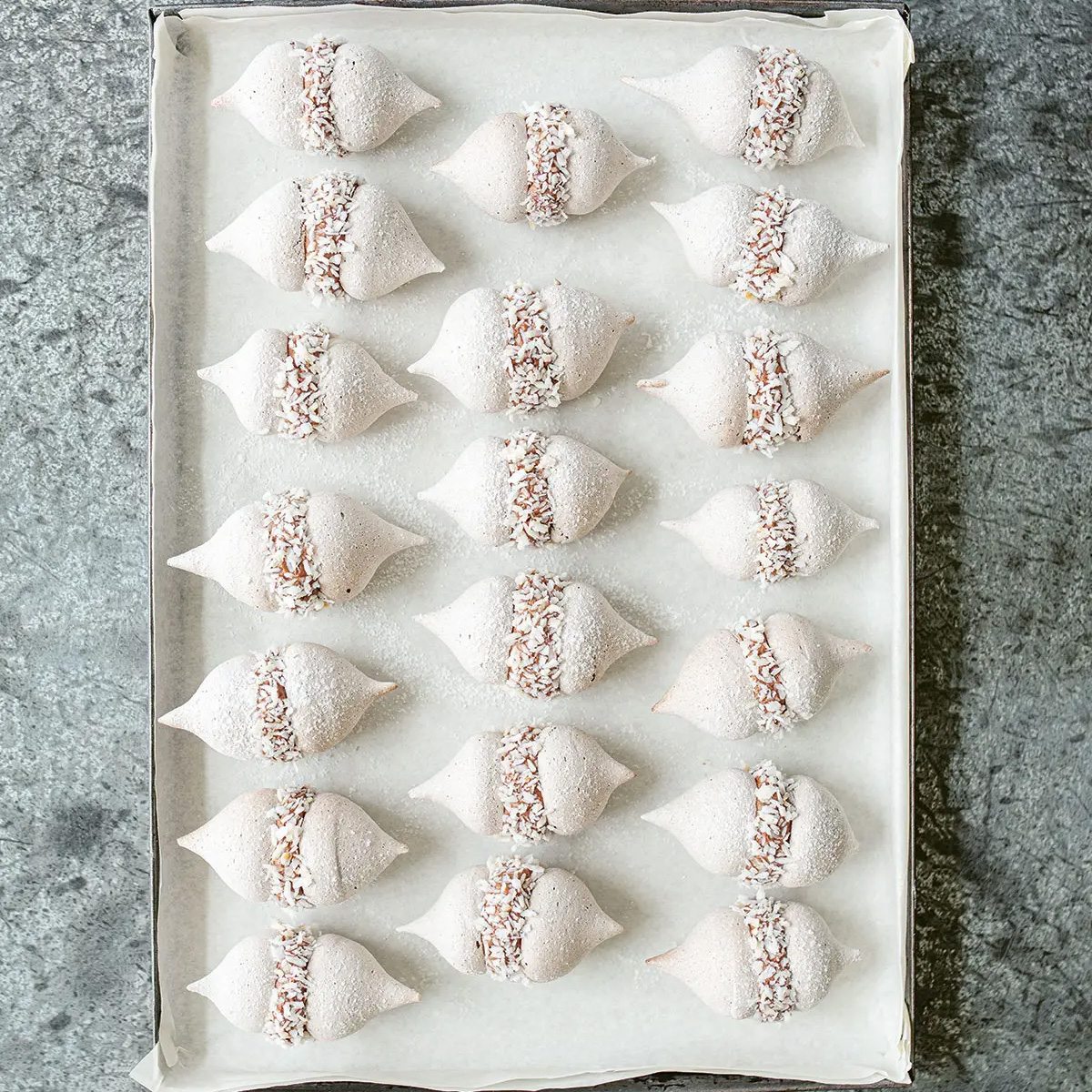 Baby Cocoa Meringues with Chocolate Cream and Candied Coconut