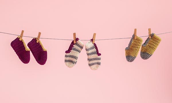 baby crochet botties on a clothing line