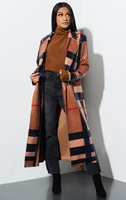 Every Time U Come Around Plaid Trench Jacket is a patent based, maxi length, oversized trench coat complete with an allover classic plaid print, crisp collar, long sleeves, matching tie belt and shiny exterior sheen.