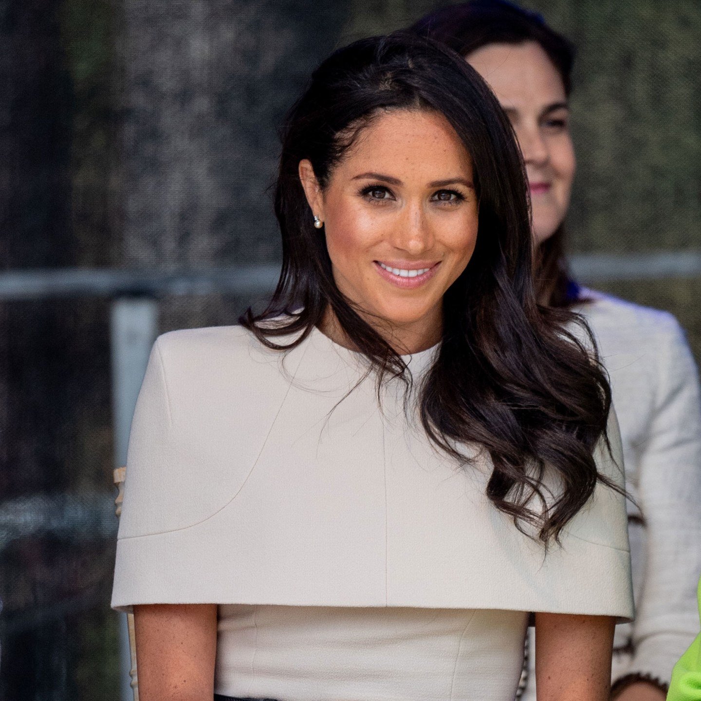 Meghan Markle pairs a blowout with a swirl of blush.