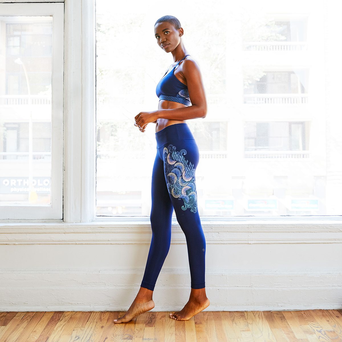 Image of a model wearing Sea Spray Legging & Lotus Bra 