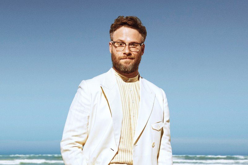 seth rogen on the beach with is dog 