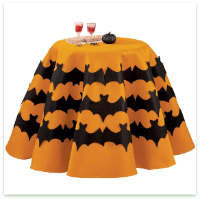 Black felt bats on an orange background make this tablecloth a fun decoration for Halloween.