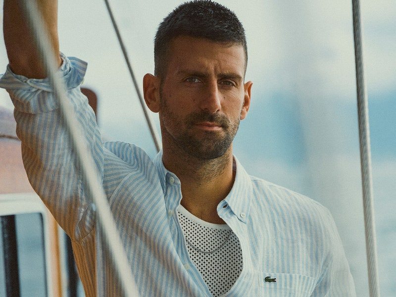 Image may contain: Novak Djokovic, Clothing, Shirt, Sleeve, Photography, Adult, Person, Face, Head, and Portrait