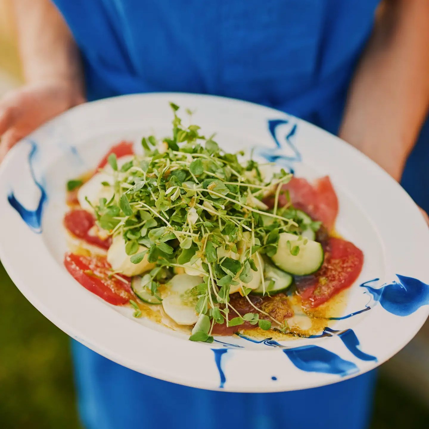 Tuna Crudo with Chamomile Oil, Cucumber Salad, and Pea Shoots