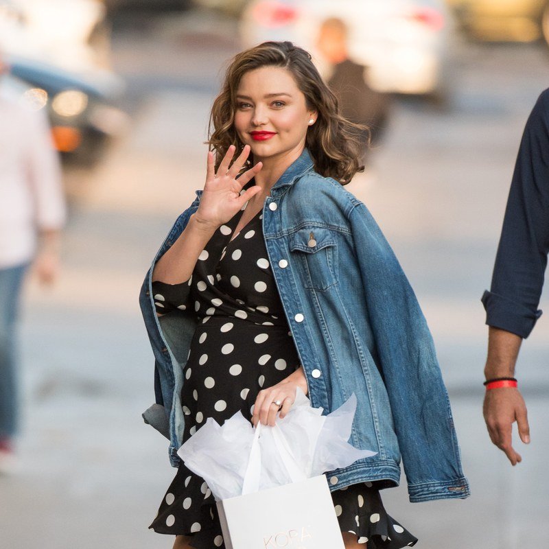 Miranda Kerr pairs a baby bump with a red lip.