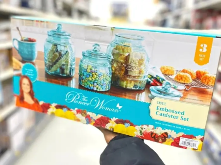 Box of Pioneer Woman Glass Canister 3-Jar Set being held at Walmart