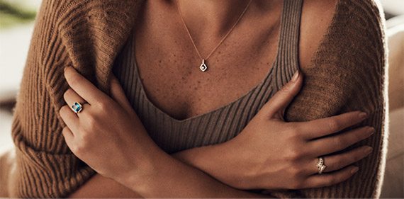 Happy woman wearing Le Vian jewelry