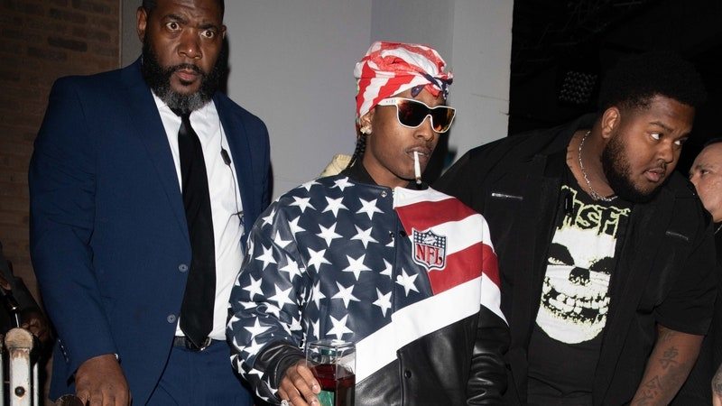 ASAP Rocky wearing red white and blue NFL jacket following the 2023 super bowl. This comes after the announcement of Rihanna being pregnant with their second child during her halftime performance.