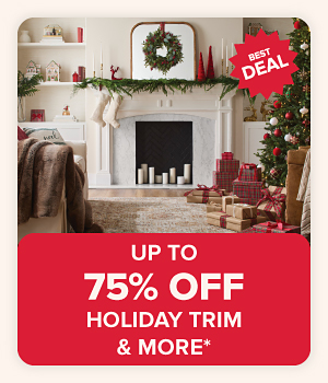 Image of a living room decorated for Christmas. Up to 75% off holiday trim and more.