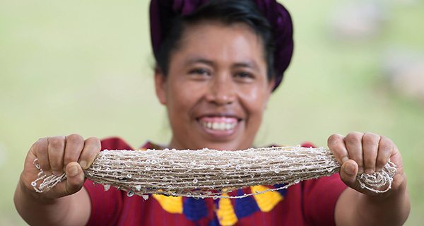 Guatemalan weaver, Mayra Hernandez, with her son Gabriel