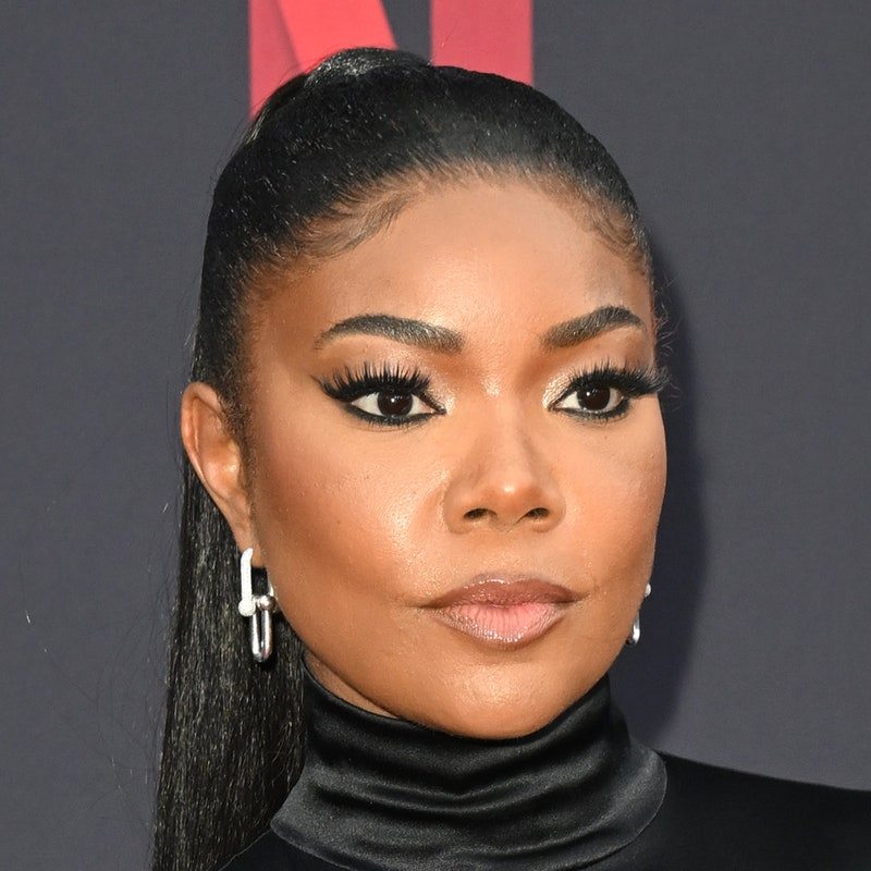 gabrielle union smizing with her hair slicked back into a high ponytail 