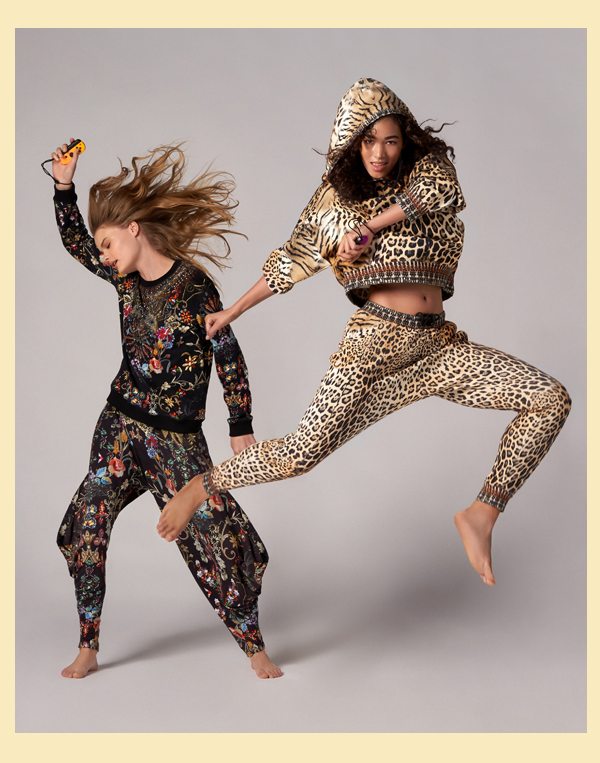 Models wearing new loungewear, jaguar hoodie and track pants and dancing in the dark sweater and pants.