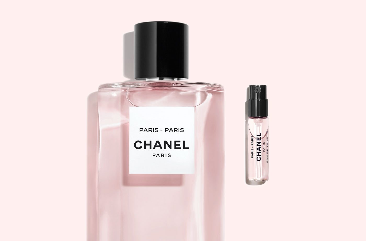 A bottle of LES EAUX DE CHANEL Paris-Paris fragrance next to a sample of LES EAUX DE CHANEL Paris-Paris