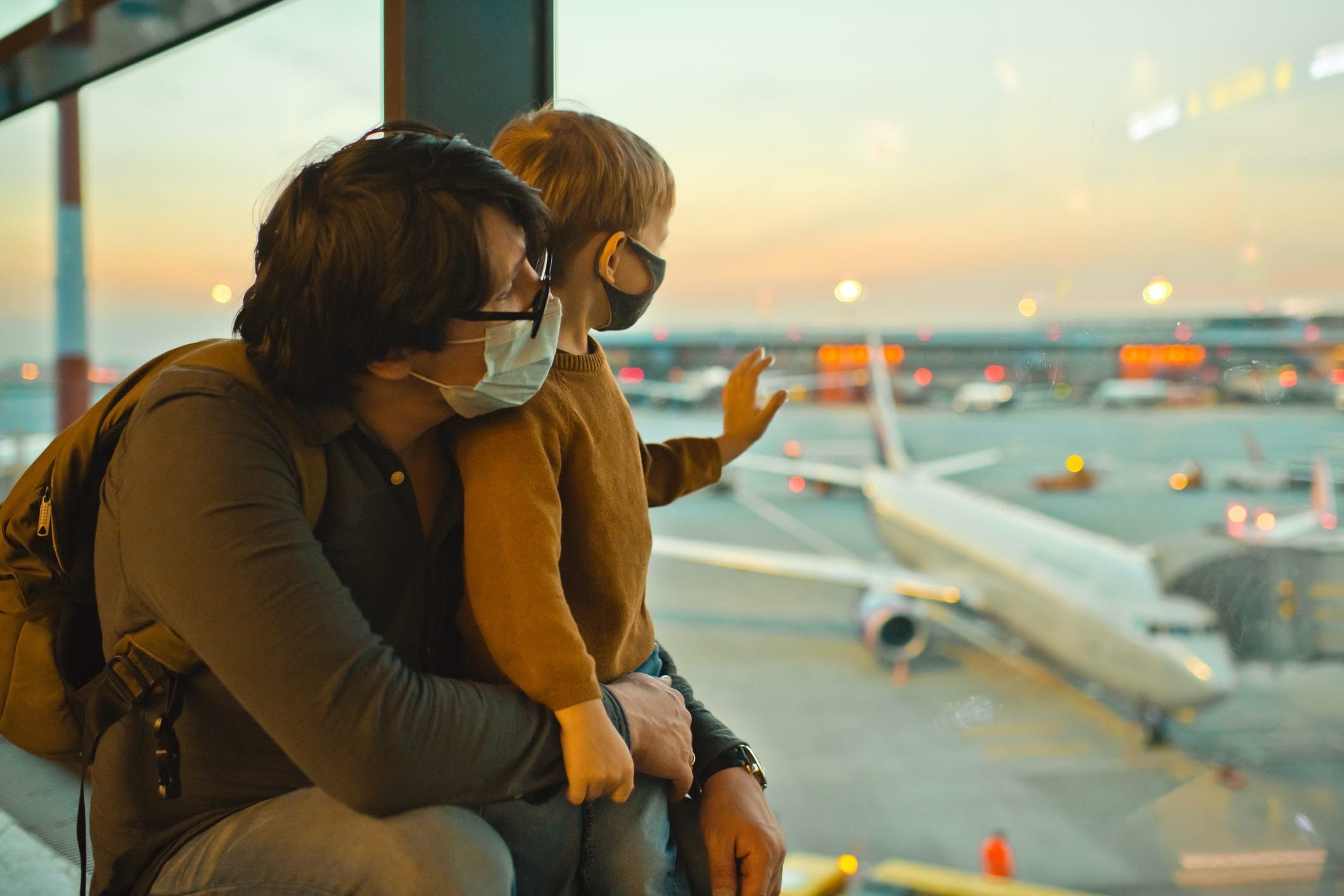 Family in face masks in airport