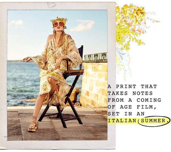 "A PRINT THAT TAKES NOTES FROM A COMING OF AGE FIL, SET IN AN ITALIAN SUMMER" Model in white and yellow, floral blouse and skirt, resting on a directors chair