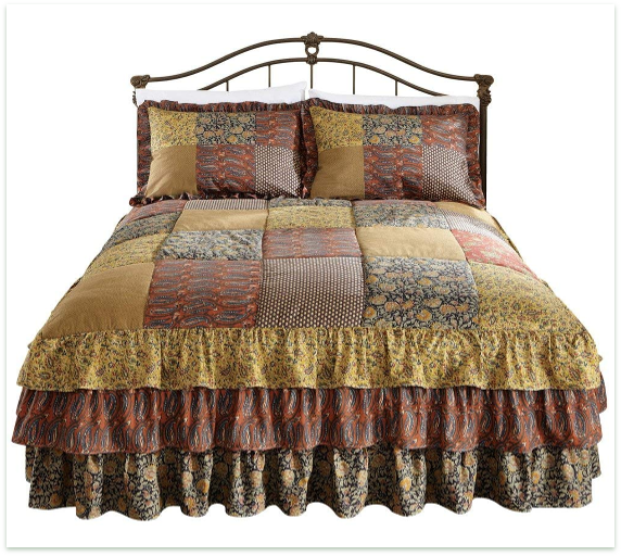 Bedspread features patchwork patterns in the rich colors of autumn. Sides are tiered and ruffled.