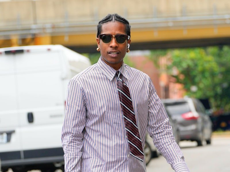 Image may contain: A$AP Rocky, Clothing, Pants, Jeans, Accessories, Formal Wear, Tie, Footwear, Shoe, Adult, and Person