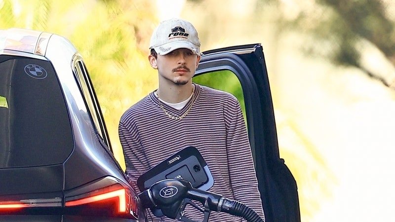 Beverly Hills, CA - EXCLUSIVE - Timothée Chalamet stays under the radar as he was seen looking nonchalant fueling up his car in Beverly Hills. The rising young star has been getting praise by movie critics for his portrayal of Bob Dylan in the new movie 'A Complete Unknown'. Many are saying Chalamet's performance may win him his first Academy Award!