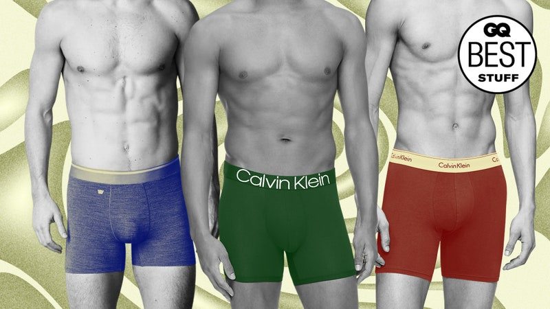 Three people wearing colorful boxer briefs on a tan abstract background