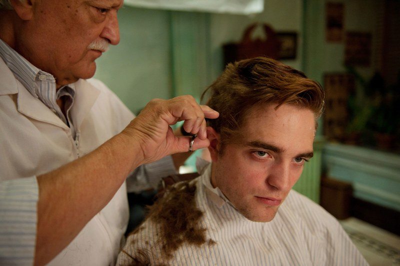  Robert Pattinson looking unamused getting a haircut