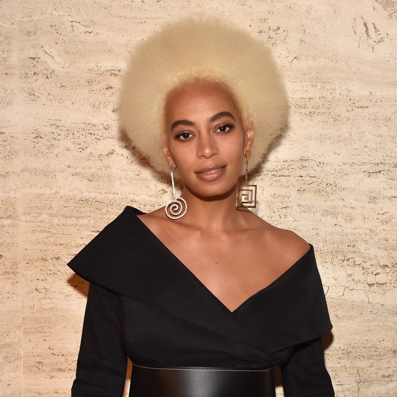 Solange Knowles pairs a peroxide Afro with graphic earrings.