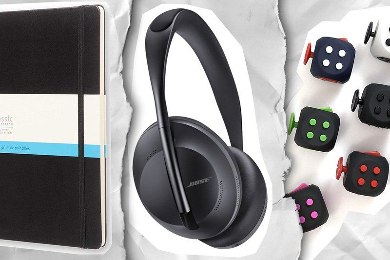 A notebook, some headphones, and some fidget cubes