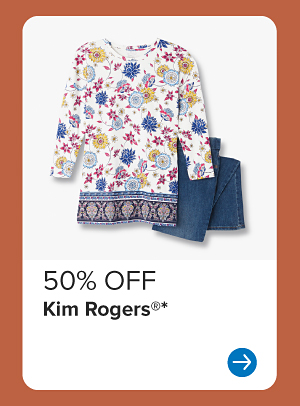 A floral blouse and blue pants. 50% off Kim Rogers.