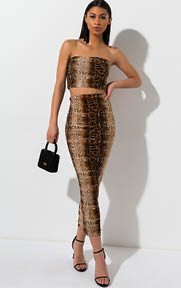 Electric Python Snake Maxi Skirt is a stretch knit based skirt complete with an allover, snakeskin patterned print, double lined interior, bodycon fit and maxi length. 