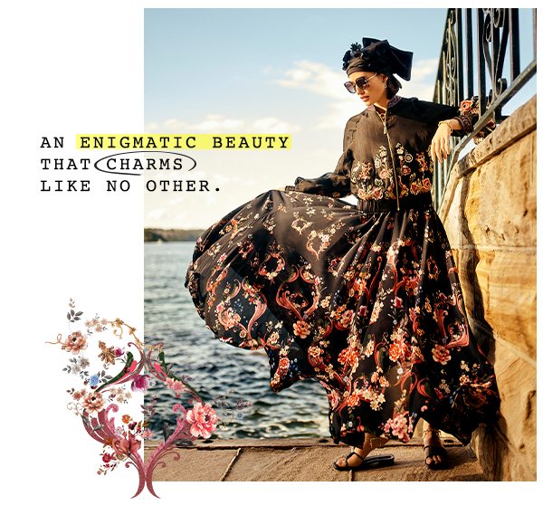 "An enigmatic beauty that charms like no other" Model in black floral dress