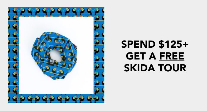 Spend $125+ and get a free Skid Tour neck gaiter, blue with a toucan design