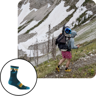 read the blog - Hiker trekking an alpine trail with trekking poles and gear.